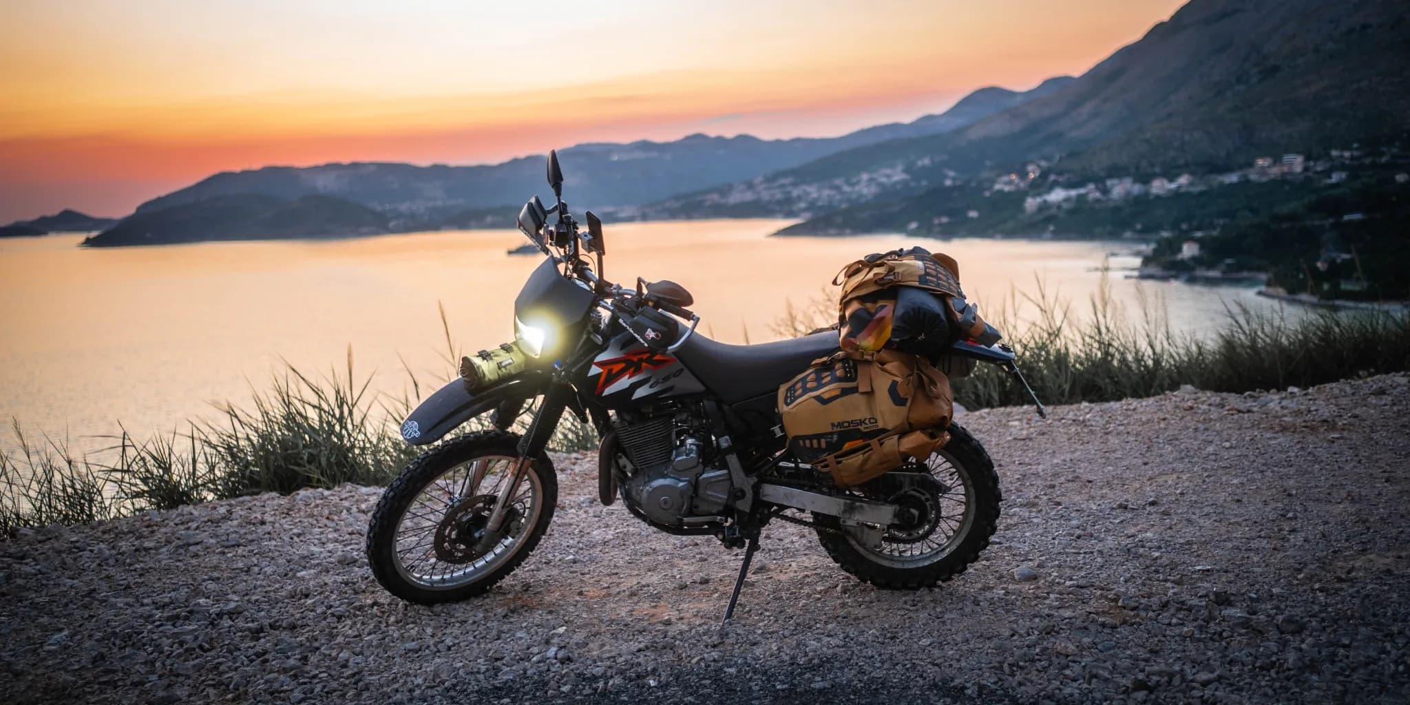 Neon-lit alley with pedestrians at dusk