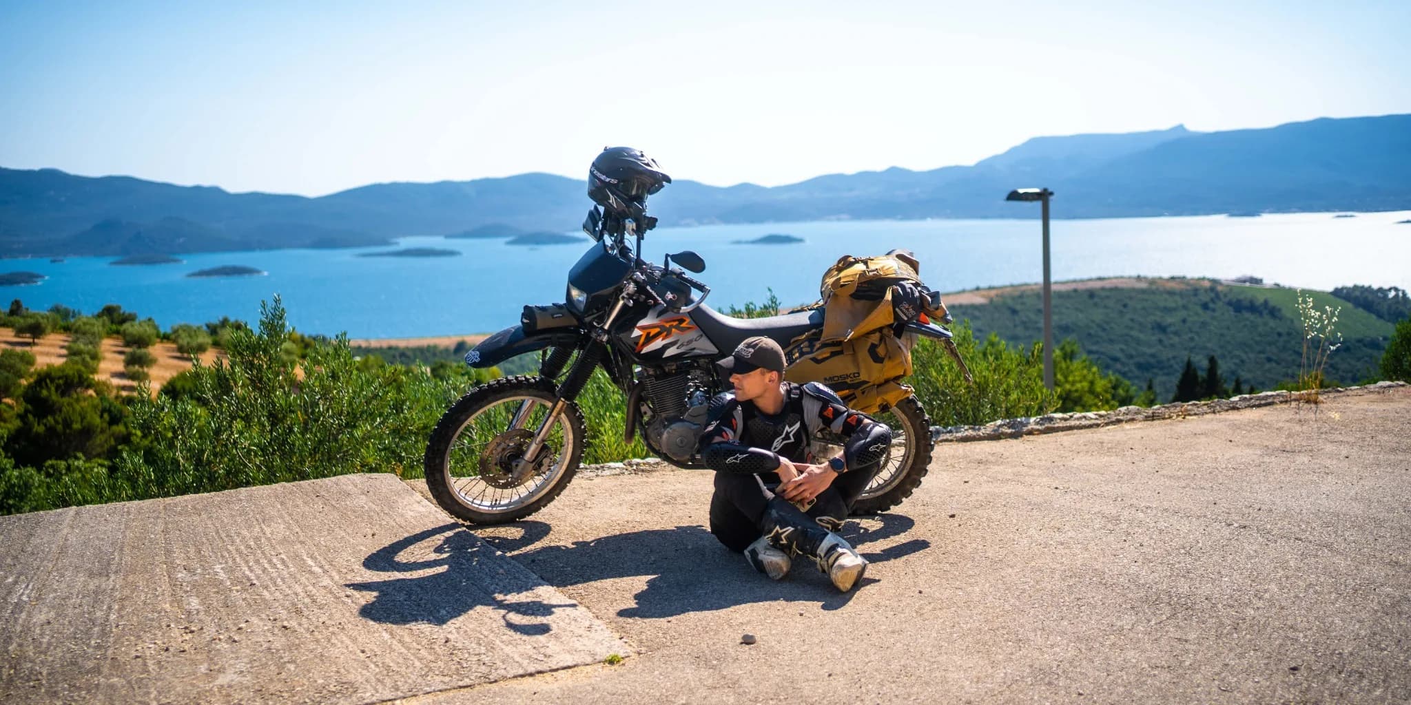 Riding gear and motorcycle on a mountain track