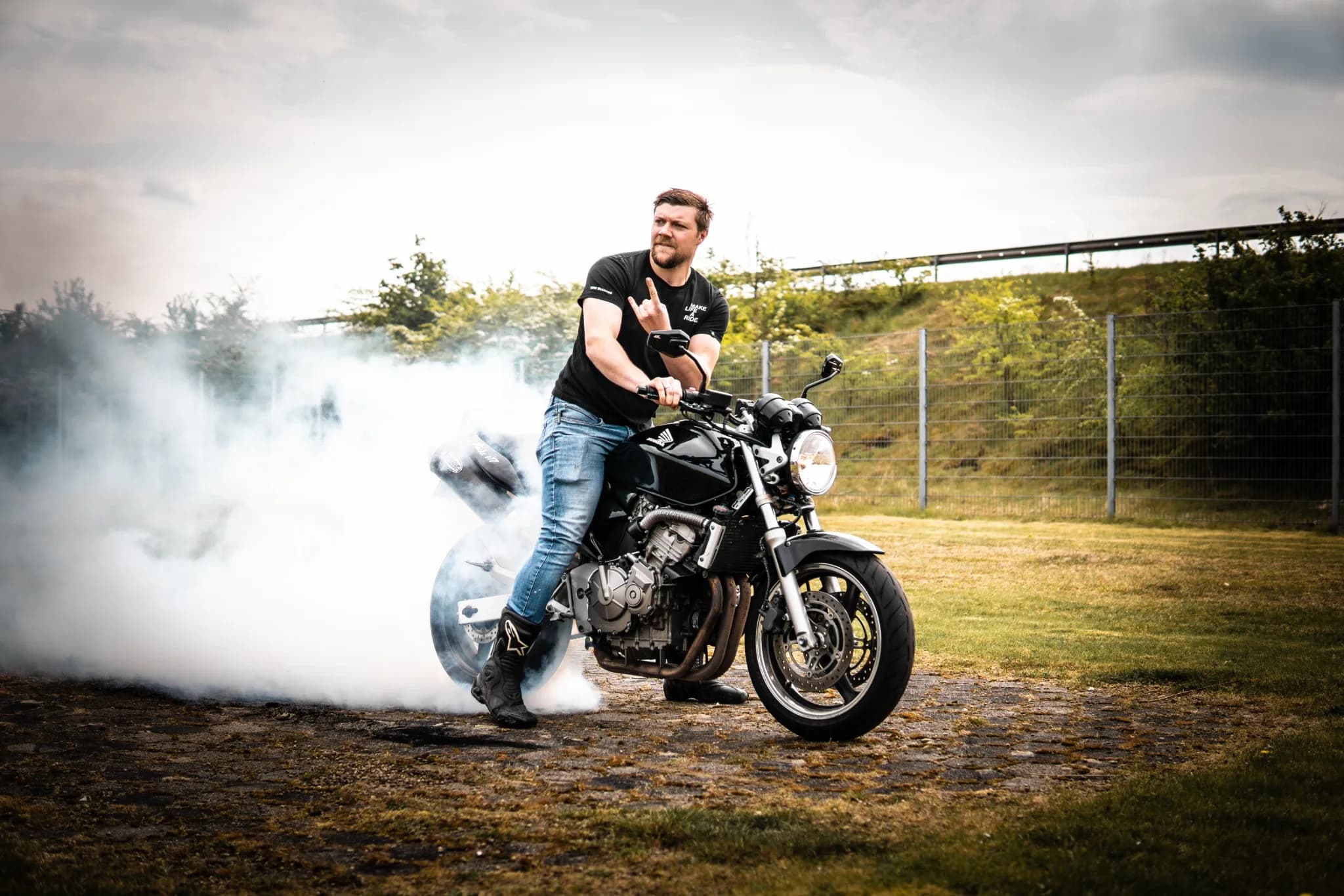 Motocross rider powering through dust