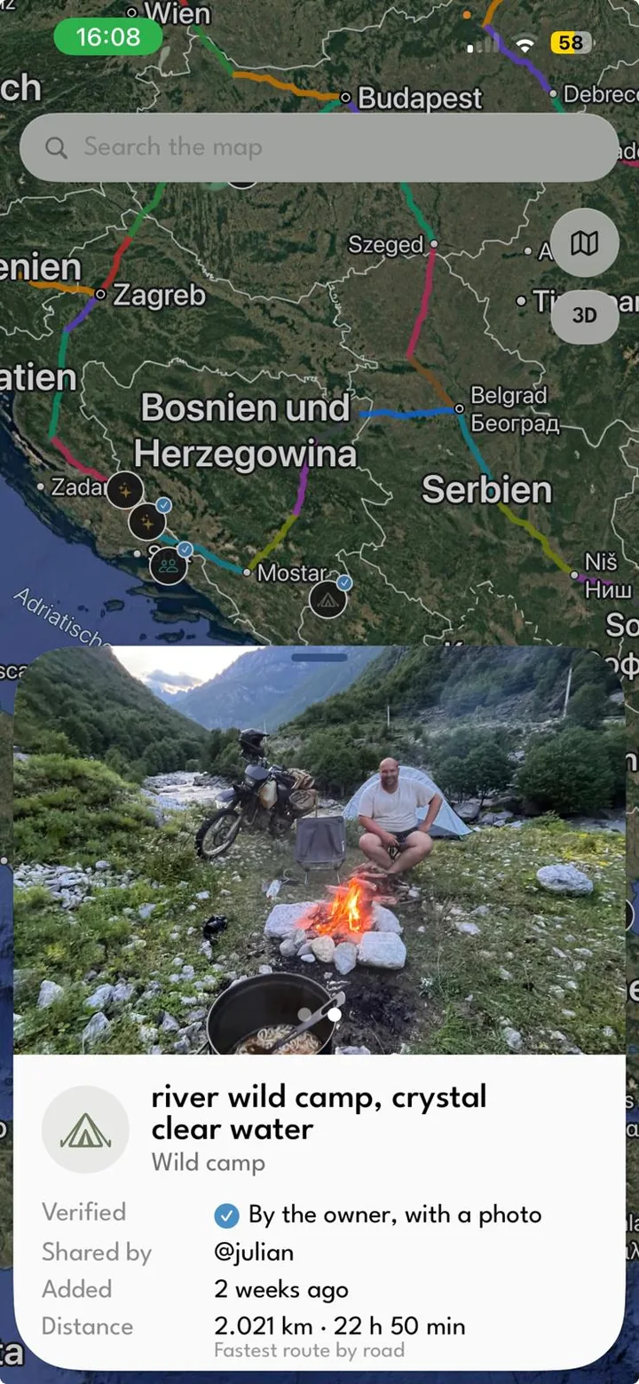 A wild camp by a river on the map, verified with a photo